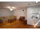 Spacious living room with wood flooring, a comfortable couch, and kitchenette at 5769 Birch St, Conover, NC 28613