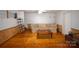 Bright living room with wood flooring and a comfortable sofa at 5769 Birch St, Conover, NC 28613