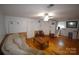 Spacious living room with wood flooring, a comfortable couch, and ample natural light at 5769 Birch St, Conover, NC 28613
