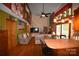 Stylish living room with hardwood floors, fireplace, quilts, and open layout to the kitchen at 5769 Birch St, Conover, NC 28613