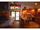 Cozy kitchen with wood cabinets, breakfast bar, fireplace, and seamless access to the living area at 5769 Birch St, Conover, NC 28613