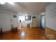 Spacious living room with wood flooring, kitchenette and ample natural light at 5769 Birch St, Conover, NC 28613
