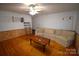 Bright living room with wood flooring and a comfortable sofa at 5769 Birch St, Conover, NC 28613