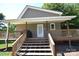 Image showing the porch, featuring wooden stairs, railings, and a covered entrance to the home at 5769 Birch St, Conover, NC 28613