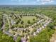 Aerial view of a suburban neighborhood with well-maintained homes, trees, and a central green space at 618 Circle Trace Rd, Monroe, NC 28110