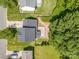 Aerial view of property with a brick patio, wood deck, and mature trees in a residential area at 618 Circle Trace Rd, Monroe, NC 28110