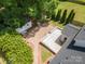 Aerial view of backyard showing a wood deck, patio with fire pit, storage shed, and green lawn at 618 Circle Trace Rd, Monroe, NC 28110