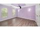 Unique bedroom with decorative purple walls, recessed lighting, and modern flooring at 618 Circle Trace Rd, Monroe, NC 28110