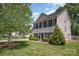Beautiful two-story home with lush green lawn, mature landscaping, and classic architectural design at 618 Circle Trace Rd, Monroe, NC 28110