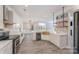 Bright, open kitchen with white cabinetry, marble backsplash, and a copper sink at 618 Circle Trace Rd, Monroe, NC 28110
