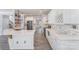 Bright, modern kitchen with white cabinets, stainless steel appliances, an island, and stylish backsplash at 618 Circle Trace Rd, Monroe, NC 28110