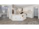 Modern kitchen with white cabinets, quartz countertops, and stainless steel appliances at 618 Circle Trace Rd, Monroe, NC 28110