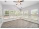 Sunroom with many windows, vaulted ceiling, and neutral paint at 618 Circle Trace Rd, Monroe, NC 28110