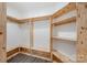 Bright walk-in closet featuring custom wood shelving and a clothing rack at 618 Circle Trace Rd, Monroe, NC 28110