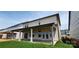 An ample back porch with large sliding glass doors to let in the light and showcase the backyard at 642 Amberjack Pl # 75, York, SC 29745