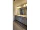 Bathroom featuring double sink vanity, large mirror, and modern fixtures at 642 Amberjack Pl # 75, York, SC 29745