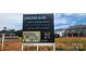 Sign showcasing amenities coming in Summer 2025, and single Gathering homes at 642 Amberjack Pl # 75, York, SC 29745