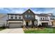 Charming two-story home with stone accents, attached garage and inviting front porch at 642 Amberjack Pl # 75, York, SC 29745