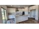 Stylish kitchen with an island, white cabinets, stainless steel appliances at 642 Amberjack Pl # 75, York, SC 29745
