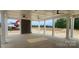 Open outdoor living space featuring a stone fireplace and ceiling fans at 642 Amberjack Pl # 75, York, SC 29745