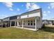 Spacious backyard with covered patio, lush lawn, and white siding home at 642 Amberjack Ln, York, SC 29745