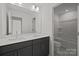 Well-lit bathroom featuring double vanity, quartz countertop, and separate shower and tub at 642 Amberjack Ln, York, SC 29745