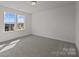 Bright bedroom featuring neutral carpeting, two large windows, and a bright view at 642 Amberjack Ln, York, SC 29745