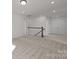 Hallway with neutral carpeting and access to multiple rooms and a staircase at 642 Amberjack Ln, York, SC 29745