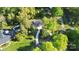 Aerial view of a home with a pool, driveway, and tree-lined landscape at 680 Lakeside Dr, Rock Hill, SC 29730