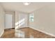 Bright bedroom with hardwood floors, closet, and neutral paint for a calming atmosphere at 680 Lakeside Dr, Rock Hill, SC 29730
