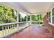 Spacious covered porch with patterned tile flooring and a backyard view at 680 Lakeside Dr, Rock Hill, SC 29730