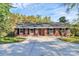 Charming brick ranch home with a spacious driveway and manicured lawn at 680 Lakeside Dr, Rock Hill, SC 29730