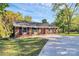 Well-maintained brick home with a manicured lawn and long concrete driveway at 680 Lakeside Dr, Rock Hill, SC 29730
