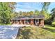 Charming brick home with a well-manicured lawn and a long driveway at 680 Lakeside Dr, Rock Hill, SC 29730
