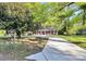 Quaint brick house with a long driveway and a mailbox on a tree-lined street at 680 Lakeside Dr, Rock Hill, SC 29730
