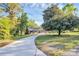 Traditional brick house with a curved driveway and lush landscaping at 680 Lakeside Dr, Rock Hill, SC 29730