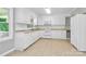 Bright kitchen boasting white cabinetry, countertops, and modern appliances at 680 Lakeside Dr, Rock Hill, SC 29730