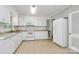 Clean kitchen with white cabinets, countertops, and modern appliances at 680 Lakeside Dr, Rock Hill, SC 29730