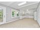 Eat-in kitchen with white cabinets, tile flooring, and access to outdoor space at 680 Lakeside Dr, Rock Hill, SC 29730
