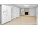 Living room features a brick fireplace, tile flooring, and backyard access at 680 Lakeside Dr, Rock Hill, SC 29730