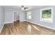 Bright living room featuring hardwood floors, natural light, and a ceiling fan at 680 Lakeside Dr, Rock Hill, SC 29730