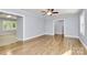 Open-concept living room with hardwood floors and view into dining area at 680 Lakeside Dr, Rock Hill, SC 29730