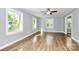 Bright living room with hardwood floors, ceiling fan, and natural light at 680 Lakeside Dr, Rock Hill, SC 29730