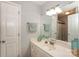 Bright bathroom featuring a vanity with decorative accents and a large mirror at 765 Southwest Dr, Davidson, NC 28036