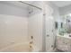 Clean bathroom featuring a bathtub with tile surround and a modern vanity at 765 Southwest Dr, Davidson, NC 28036