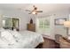Bright bedroom with a ceiling fan, large window, and access to a screened porch at 765 Southwest Dr, Davidson, NC 28036
