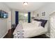 Comfortable bedroom with a large window, sleek TV, and elegant decor at 765 Southwest Dr, Davidson, NC 28036