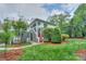Inviting two-story condo featuring well-maintained landscaping, a charming exterior, and a private entrance at 765 Southwest Dr, Davidson, NC 28036