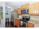 Modern kitchen with stainless steel appliances, granite countertops, and sleek cabinetry at 765 Southwest Dr, Davidson, NC 28036