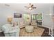 Comfortable living room with a sliding glass door to the porch, hardwood floors, and tasteful decor at 765 Southwest Dr, Davidson, NC 28036